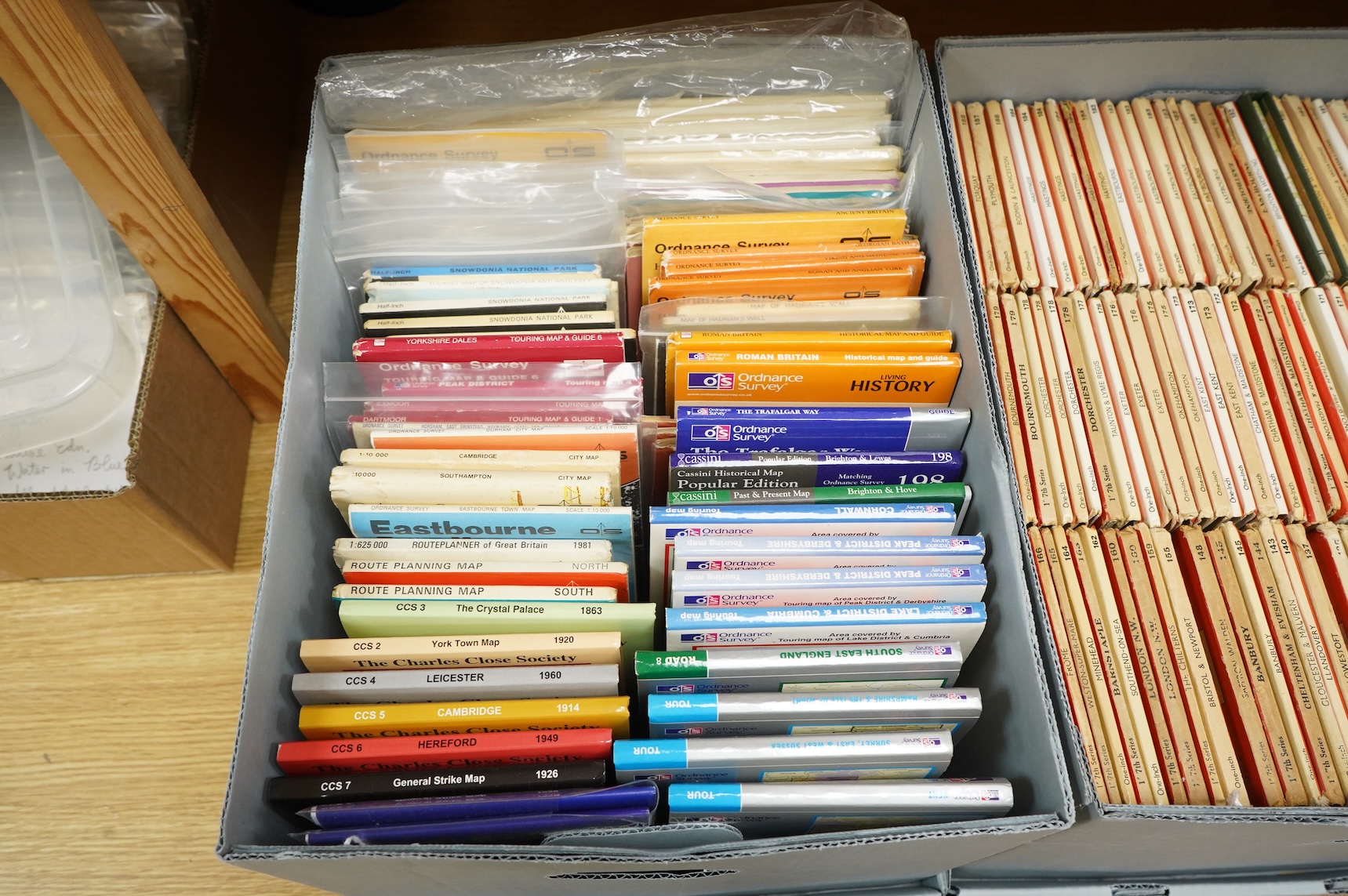 A collection of Ordnance Survey maps including Explorer series 1:25,000, Seventh Series One Inch, together with miscellaneous touring and historic editions (3 boxes)